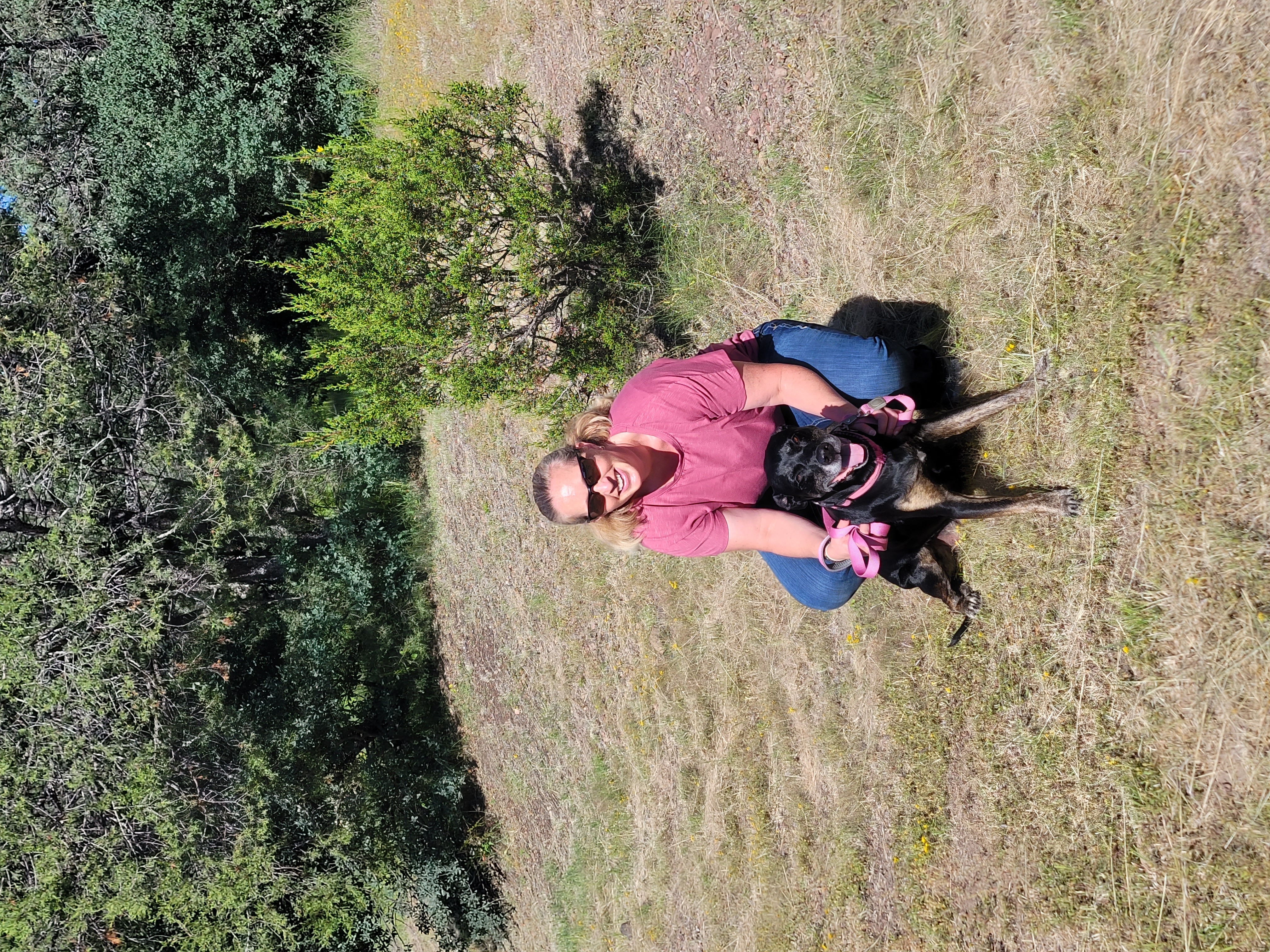 Dog trainer with dog outdoors